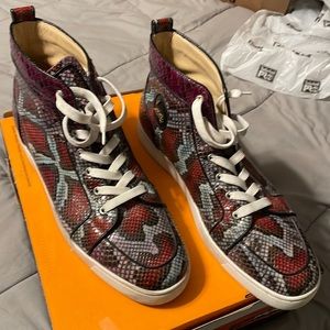 RED BOTTOMS sz14 (48)Christian Louboutin sneakers in good shape  A 8 out of 10.